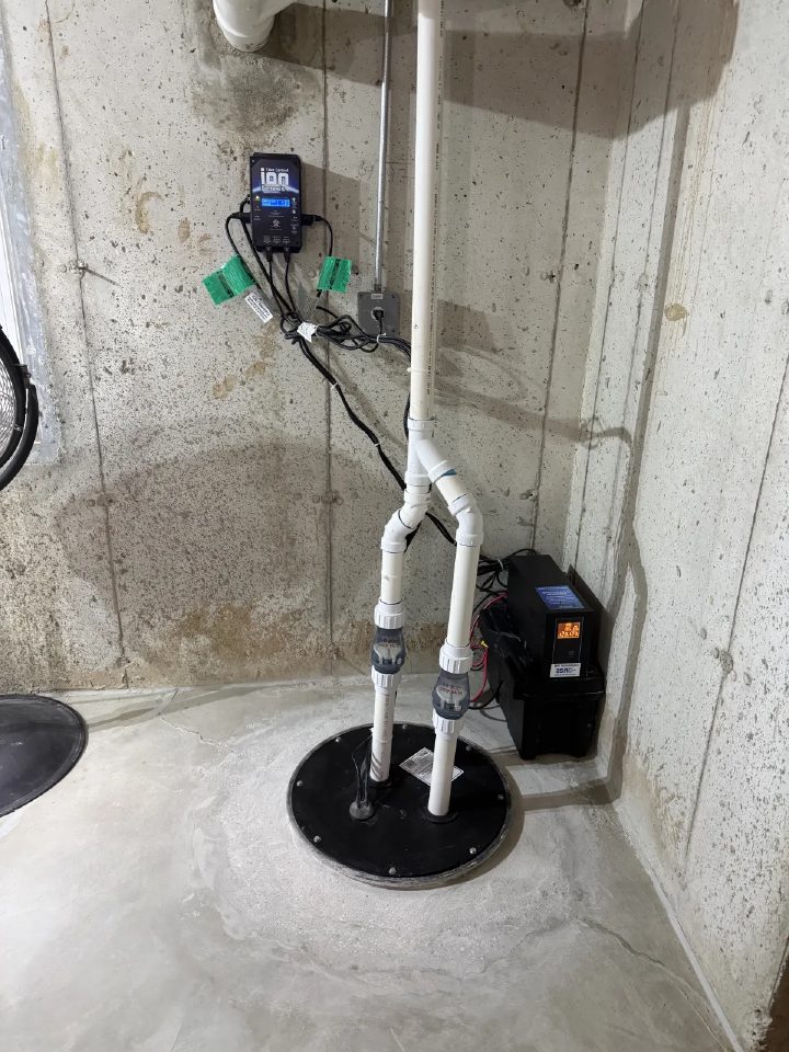 A deeper sump pit with a new sealed lid and a battery backup pump system installed in a Campton Hills basement