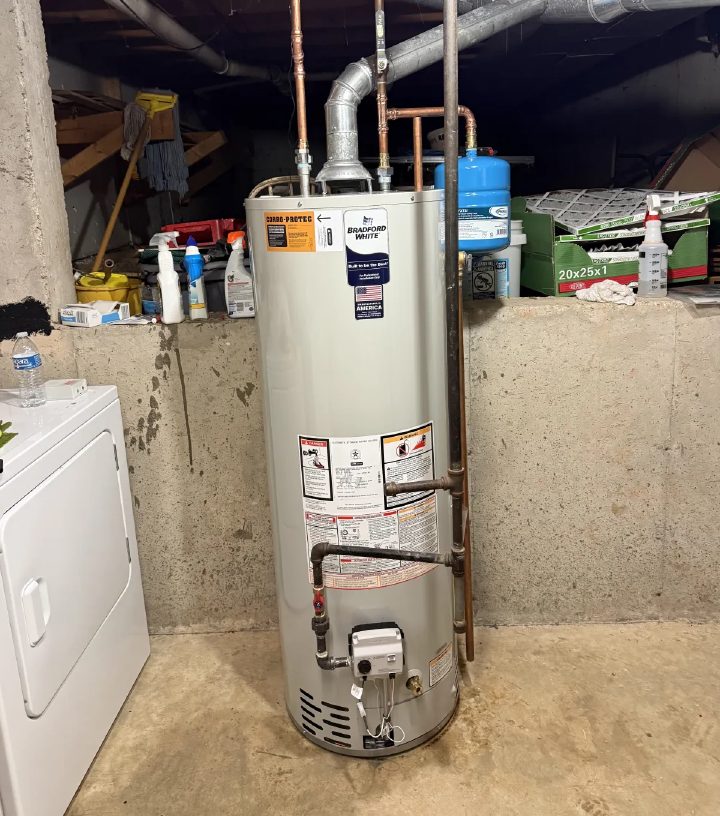 Bradford White 40-gallon tank water heater installed in a St. Charles basement with copper supply lines, galvanized flue venting, a Corro-Protec electric anode rod, and a thermal expansion tank